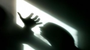 Silhouette of raised hand